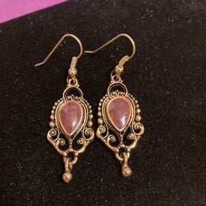 Antique gold tone ornate earrings with enameled teardrop center